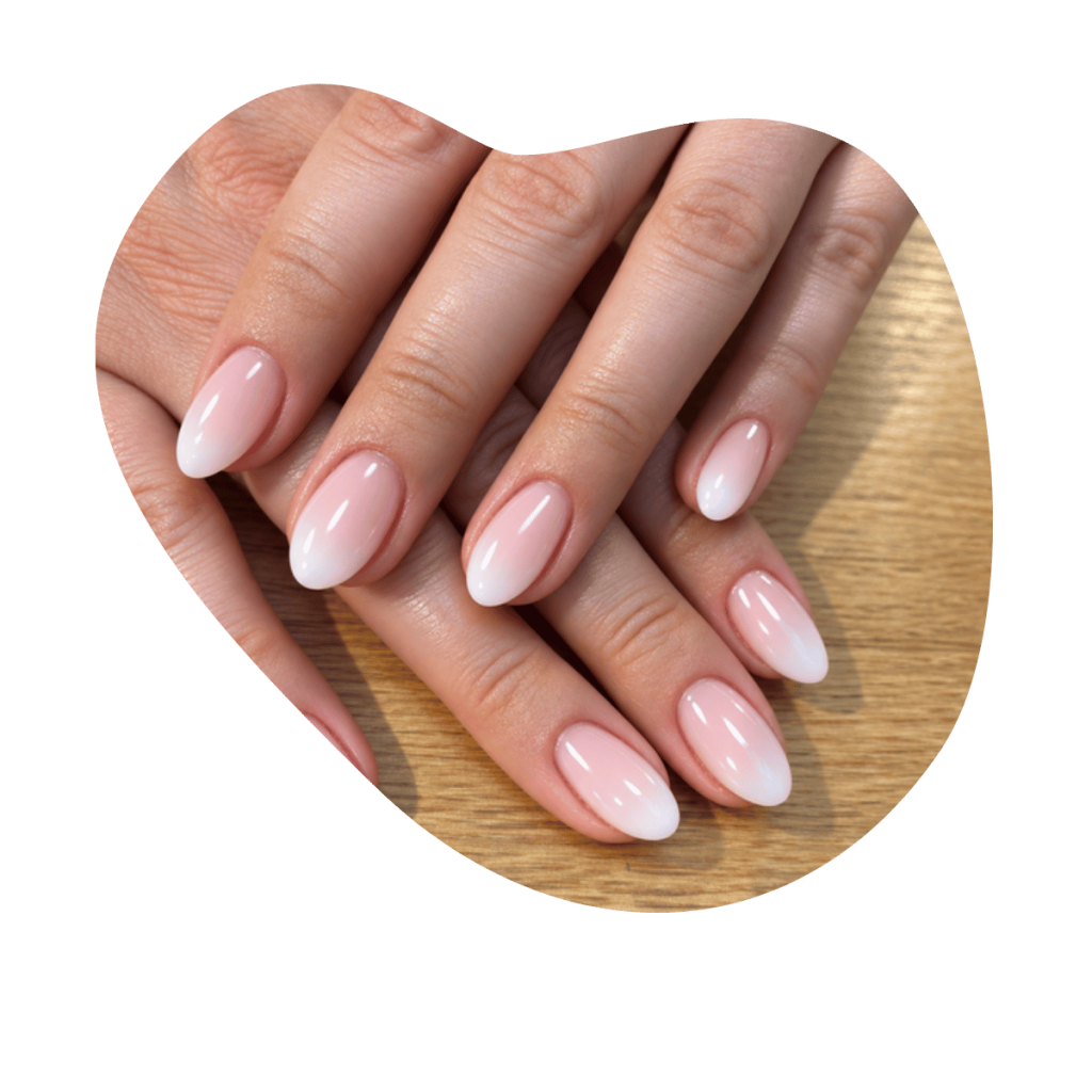Babyboomer N&auml;gel mit weichem Verlauf von Ros&eacute; zu Weiss auf ovaler Nagelform, Nageldesign Basel.