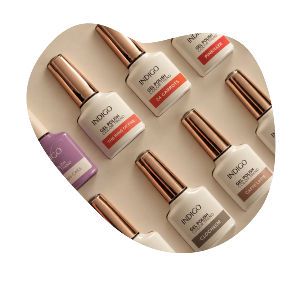 Indigo Nails Gel Polish Color Trend Flaschen mit ros&eacute;goldenen Deckeln in der Auslage, Nagelprodukte bei Beautylounge Basel.